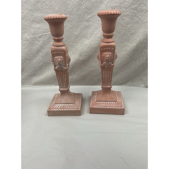 Nicely detailed pair of Lions head accented candleholders. These are unglazed,lovely soft terra cotta