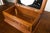 An English oak decorative box from the 19th century with carved dog on the lid, stylized foliage on the front and...