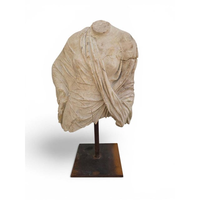 Elegant Greek-style bust sculpture created during the second half of the 20th century, inspired by classical antiquity and...