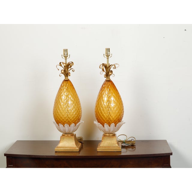 A pair of Italian Venetian Murano glass pineapple style table lamps from the 20th century, with cross-hatched motifs, gilt...