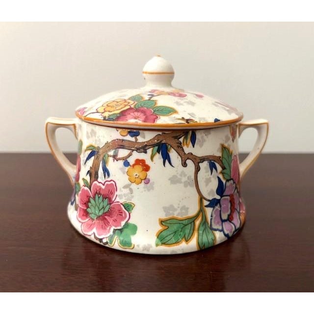 Crown Ducal porcelain transferware sugar and creamer, chintz pattern Festival, c1925-1930, made in England. Both pieces...