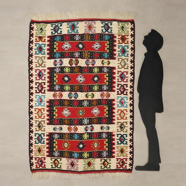 Kilim rug in wool, fine knot and hand made. This piece is attributed to the mentioned designer/maker. It has no...
