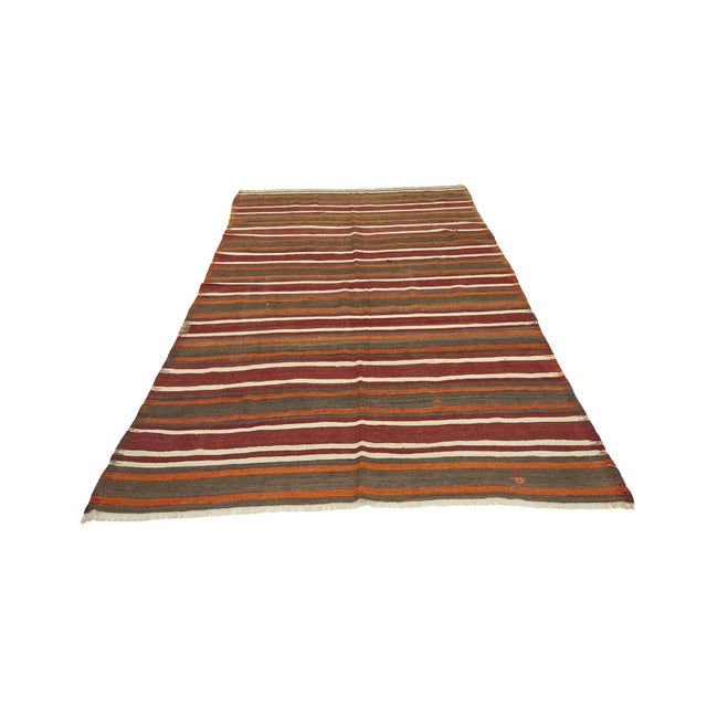 Handwoven vintage kilim rug from Denizli region of Turkey. Approximately 45-55 years old. In good condition.