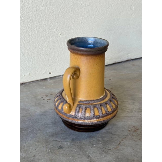 This striking mid-century Strehla Keramik vase was produced in East Germany during the 1950s–60s and showcases the...