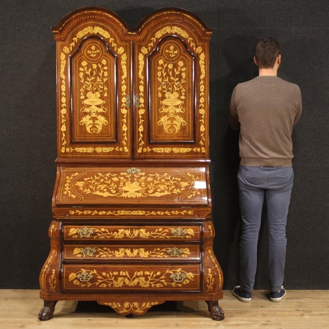 Fabulous 20th century Dutch trumeau. Moved and rounded furniture richly inlaid in walnut, mahogany, beech, maple and...