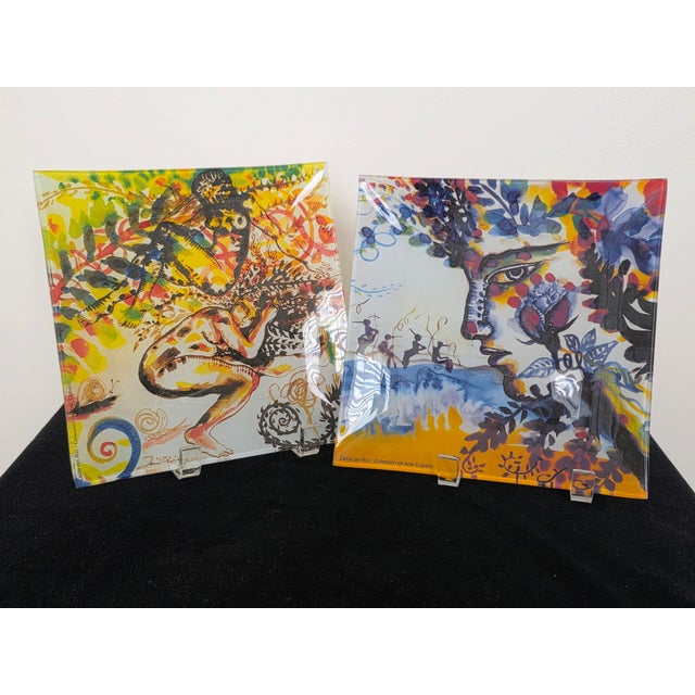Pair of vintage art glass painted plates designed by artist Zaida del Rio. Each measure 8" square and sit 1/2" high. Zaida...