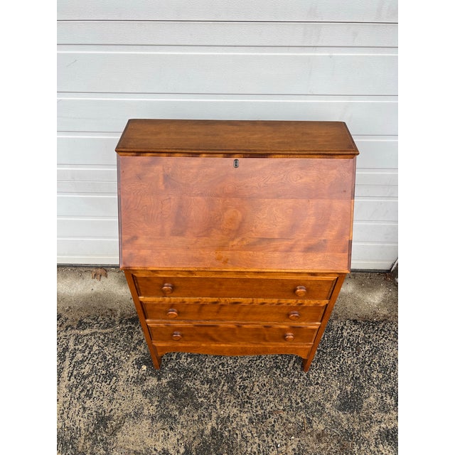 This vintage secretary desk features hardwood construction, beautiful maple veneer with original finish, three drawers...