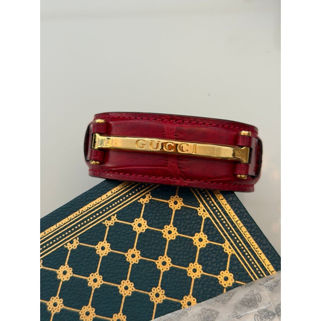Gucci 1990’s Gucci Red Crocodile Style Leather Bracelet With Gold Tone Engraved Logo Narrow Horse Bit For Sale - Image 4 of 11