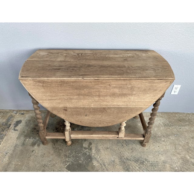 Antique French bleached oak gate leg table with beautiful coloration and so versatile. As a sofa back table, entry table,...