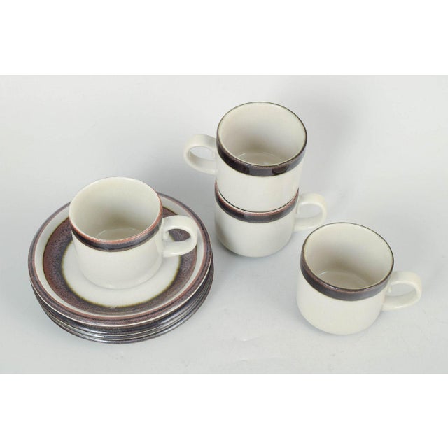 Arabia Karelia, set of four tea cups with matching saucers. Classic stoneware set consisting of four tea cups and four...