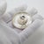 A vintage object depicting a traditional Mexican sombrero in miniature, crafted between the 1970s and 1980s in authentic...
