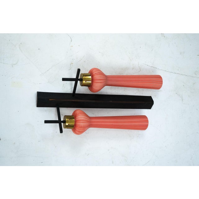 An impressive and stylish large Italian Mid-Century wall sconce designed in the distinctive manner of Stilnovo, dating...