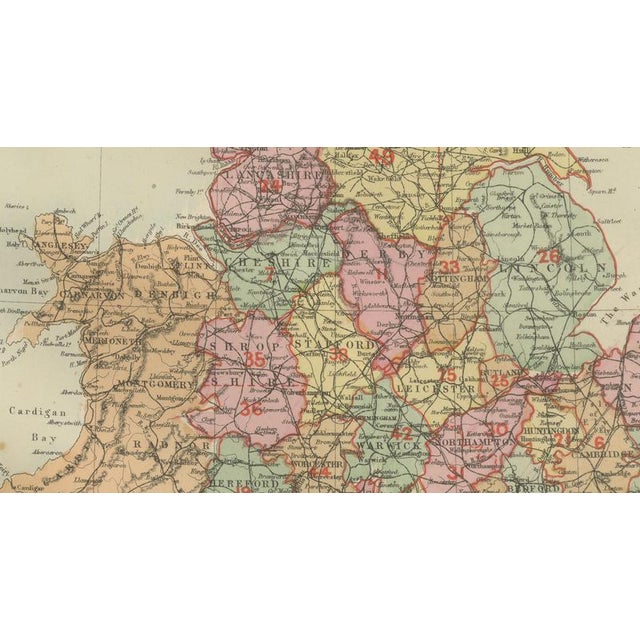This attractive antique map of England was published in 1885 by George W. Bacon in London as part of the New Large Scale...