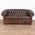 20th century Spanish brown leather Chesterfield 2- seat sofa or loveseat. Classic Chesterfield form with rolled arms,...