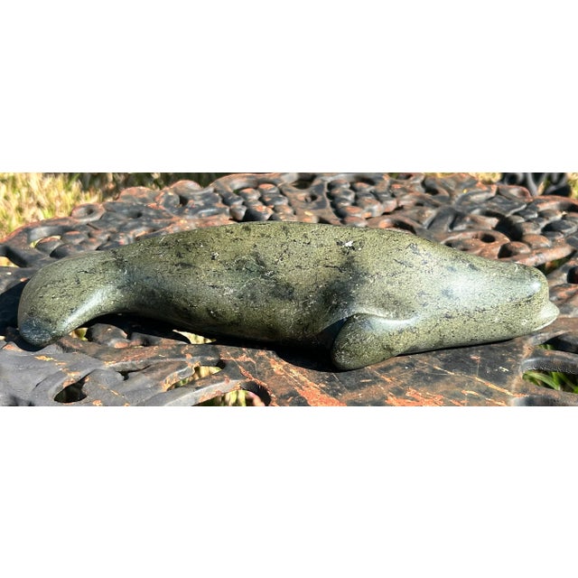 Up for sale is a Vintage Canadian Inuit Beluga Whale Serpentine Stone Carving by Nooshoota Paduq (1979)! It measures 10...