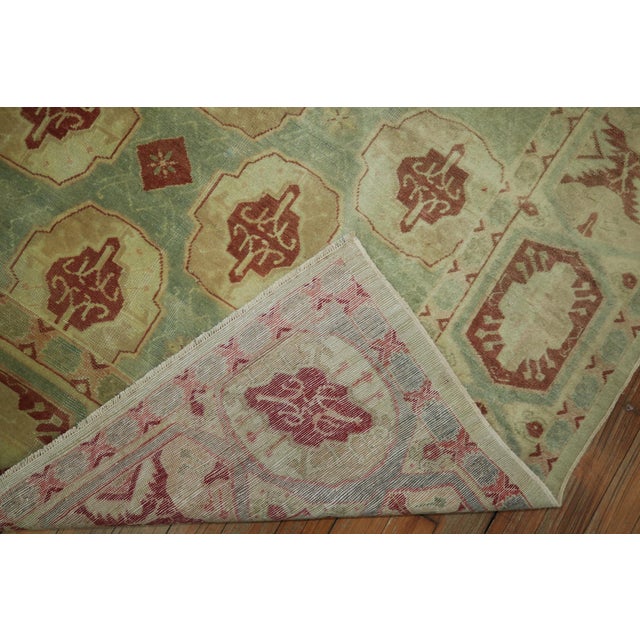 A superb small antique Turkish rug. Predominantly seafoam green and burnt gold giving it a faded, sublimed look, circa...