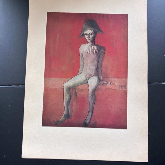 After Pablo Picasso, Seated Harlequin Boy With Red Background. Limited Edition Chromolithograph Printed in Switzerland by Skira in the 1940s For Sale In Boston - Image 6 of 6