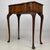 A graceful and beautifully crafted early 20th-century English Edwardian side table, constructed in richly figured walnut...