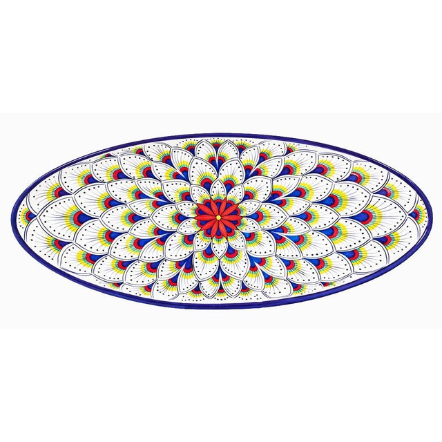 The Intreccio Oval Serving Platter brings centuries of Italian ceramic artistry to your table. Hand-painted by master...