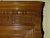 Antique late 19th century overmantel mirror having stained maple frame with paneled design and beveled glass mirror. The...