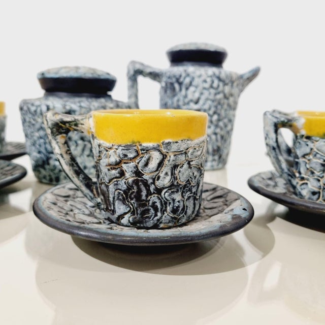 The set features a striking, glossy marbled or crackle-glaze pattern (often referred to as a "dripped" or "lava" effect)...