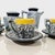 The set features a striking, glossy marbled or crackle-glaze pattern (often referred to as a "dripped" or "lava" effect)...