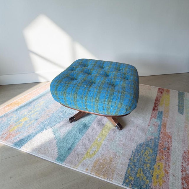 A striking vintage Heywood-Wakefield lounge chair and matching ottoman featuring a sculptural maple hardwood frame,...