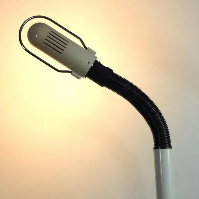 A floor lamp made of varnished metal from Germany. One lighting point equipped with a bulb with E27 thread. It has an...