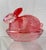 Cranberry pink, shiny nesting bunny. No chips or cracks noted. Stands 4” tall x 4.5” x 3.25”.