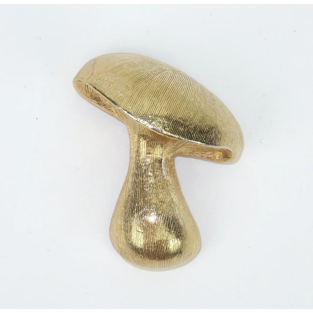 Sprouting up everywhere! Pair of 1960's gold plated mushroom brooches including a small one by Trifari. The brooches are...