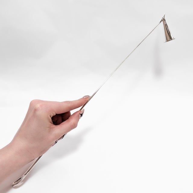 A fine signed silver candle snuffer. In sterling silver. By Elsa Peretti for Tiffany & Co. In the Padova pattern. Marked...