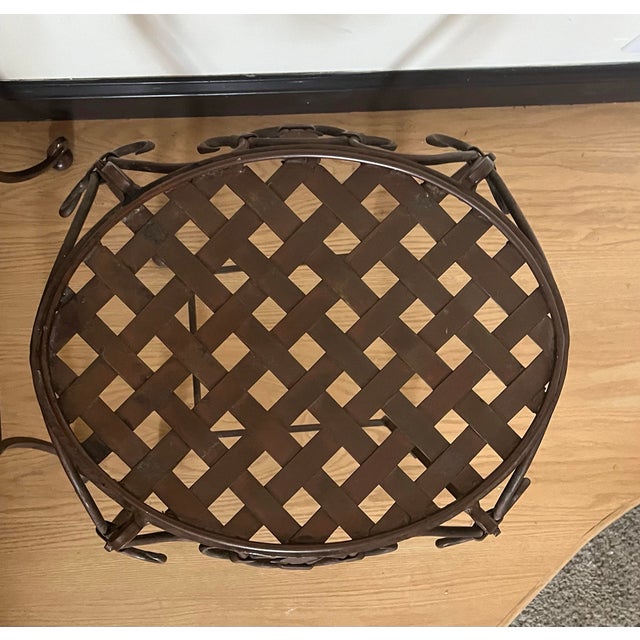 Beautiful pair of vintage wrought iron side tables. The color is a bronzed chocolate, but can easily be painted to the...