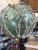 These antique Japanese glass fishing floats are hand‑blown in the traditional style used by fishermen throughout the...