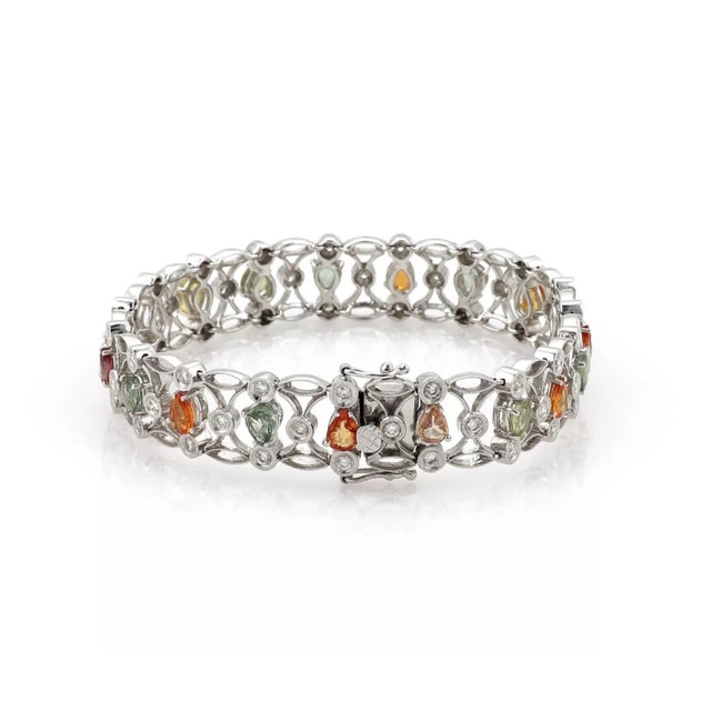 This gorgeous bracelet is crafted from 14k white gold with a textured polished finish. It has approximately half an inch...