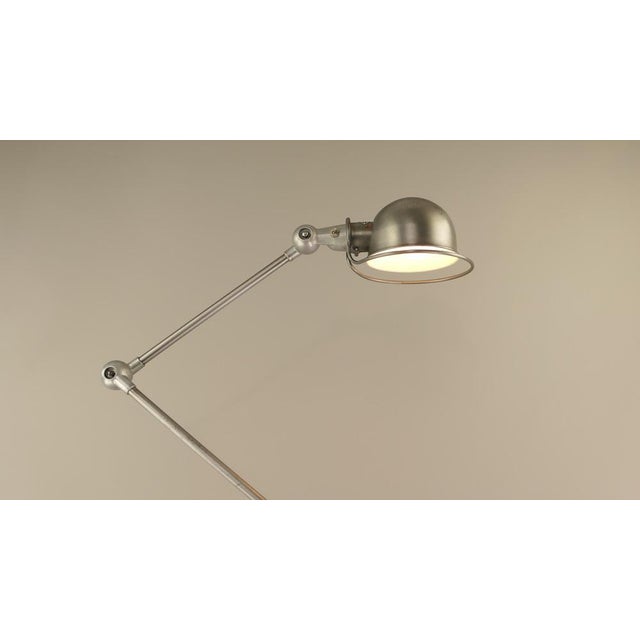 An ingenious adjustment system without limits. all arms including lampshade are individually adjustable. the arms are...