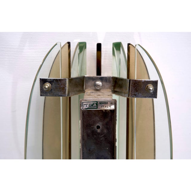 This set of four sconces, made of thick glass and chrome, was produced by Veca in Italy during the 1960s. They are in very...