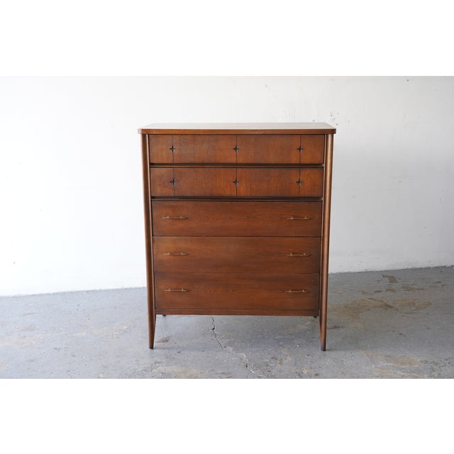 Beautiful vintage Broyhill Saga highboy dresser, produced in the 1960s. This classic mid-century modern piece features...