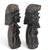 A matched pair of mid-century Japanese Ainu folk figures, hand carved in Hokkaidō and depicting a man and woman in...