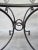 This is a beautiful wrought iron glass table with unique round door pull hanging accents. This table could be used in your...