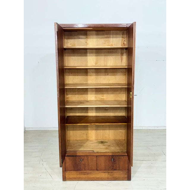 For sale is this beautiful vintage oak cabinet, distinguished by its warm brown tone and timeless design. The piece offers...