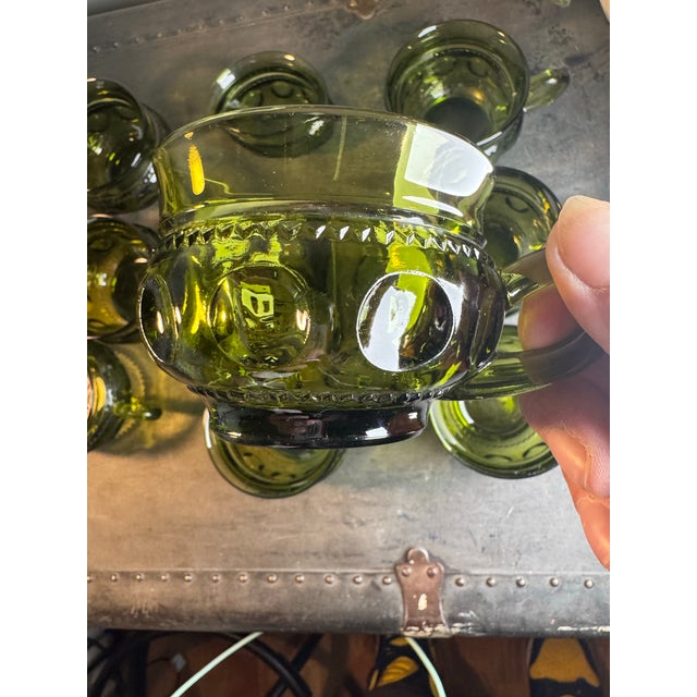 Beautiful vintage pressed-glass cups featuring the distinctive Kings Crown Thumbprint pattern and decorative handled...