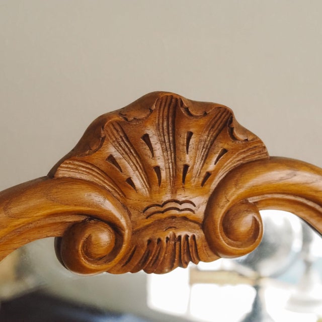 A French-inspired dressing table with an attached mirror, reminiscent of 18th-century Louis XV forms. The flowing lines,...