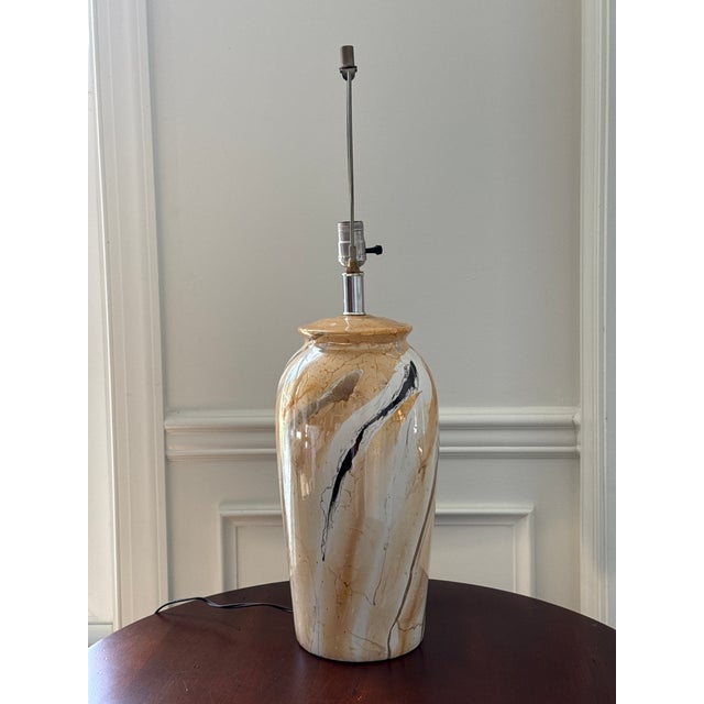 This vintage hand painted pair of lamps is on trend with their neutral and goldenrod colors. The larger size is certain to...