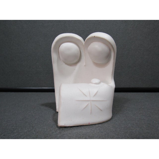 A small mid-century modern abstract family sculpture in softly glazed matte white studio pottery, signed “…mas Pottery” on...