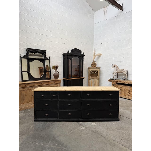 This antique cabinet has been fully restored. It consists of a black-patinated cabinet body and a raw fir wood top. It...