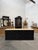 This antique cabinet has been fully restored. It consists of a black-patinated cabinet body and a raw fir wood top. It...