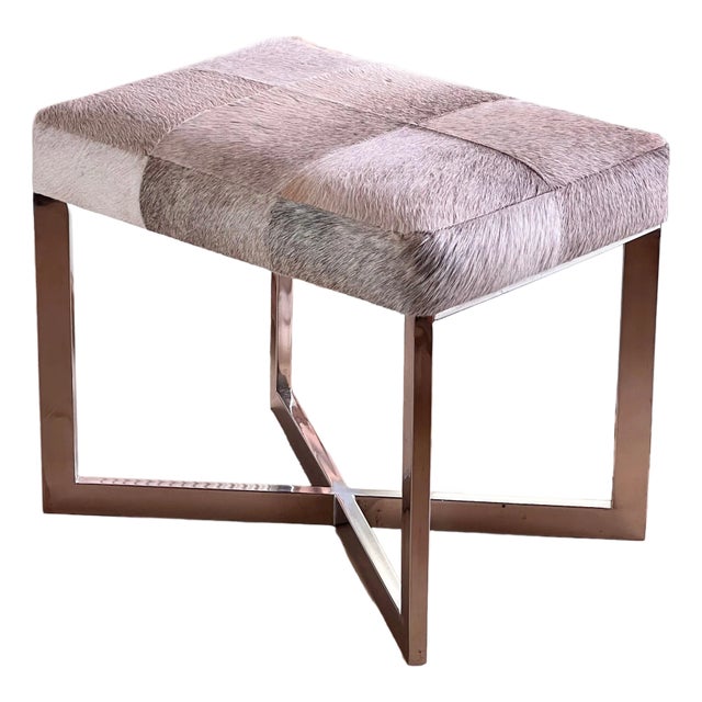 A Modernist Cowhide And Chrome Ottoman, 20Th Century. For Sale