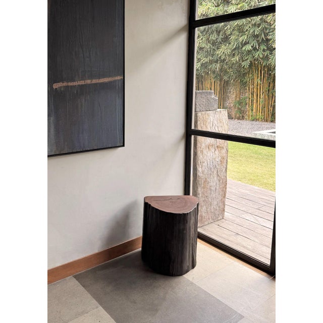 Crafted from resilient ulin wood—also known as Bornean ironwood—this side table is a true statement of natural elegance...