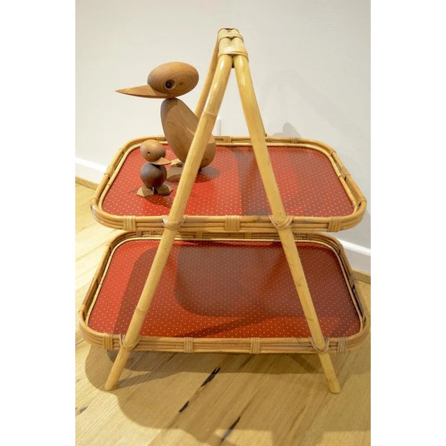 Midcentury rattan-bamboo serving table or side table from the 1950s. Two red vinyl with dot decor.