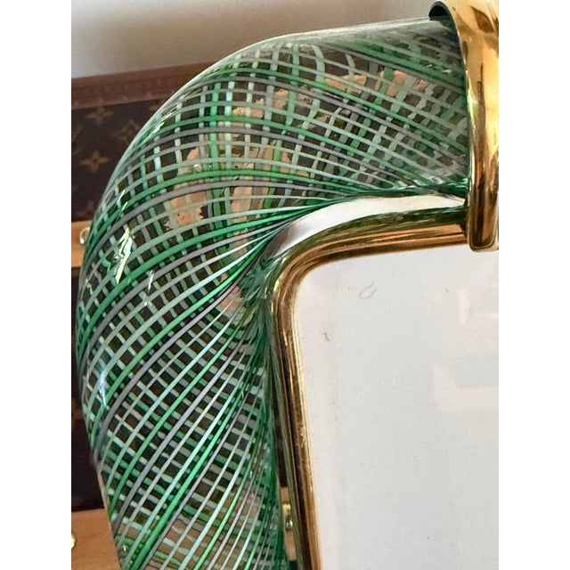 This magnificent vertical photo frame is purely in the tradition of Venetian glassmaking. The technique used to achieve...